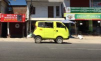 A Tata (really) mini van parked on the street in Kumali.