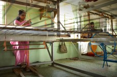 Weaving is a core part of the Women’s Co-op. Rabia has been operating one FFC loom for seven years. In the Women’s Co-op a wheel called a Charkha is used to spin thread from damaged cocoons in to a nubby silk thread, which is dyed and woven into products.