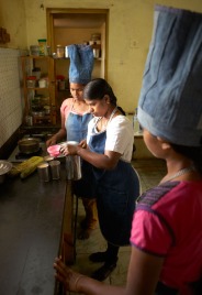 Canteen manager, Shainee, conducting her weekly cooking class with five girls. Learning to cook is one of the “marriage skills” that girls learn. Today they are learning to make breakfast dosas, cauliflower chili, coconut chutney and tomato chutney.
